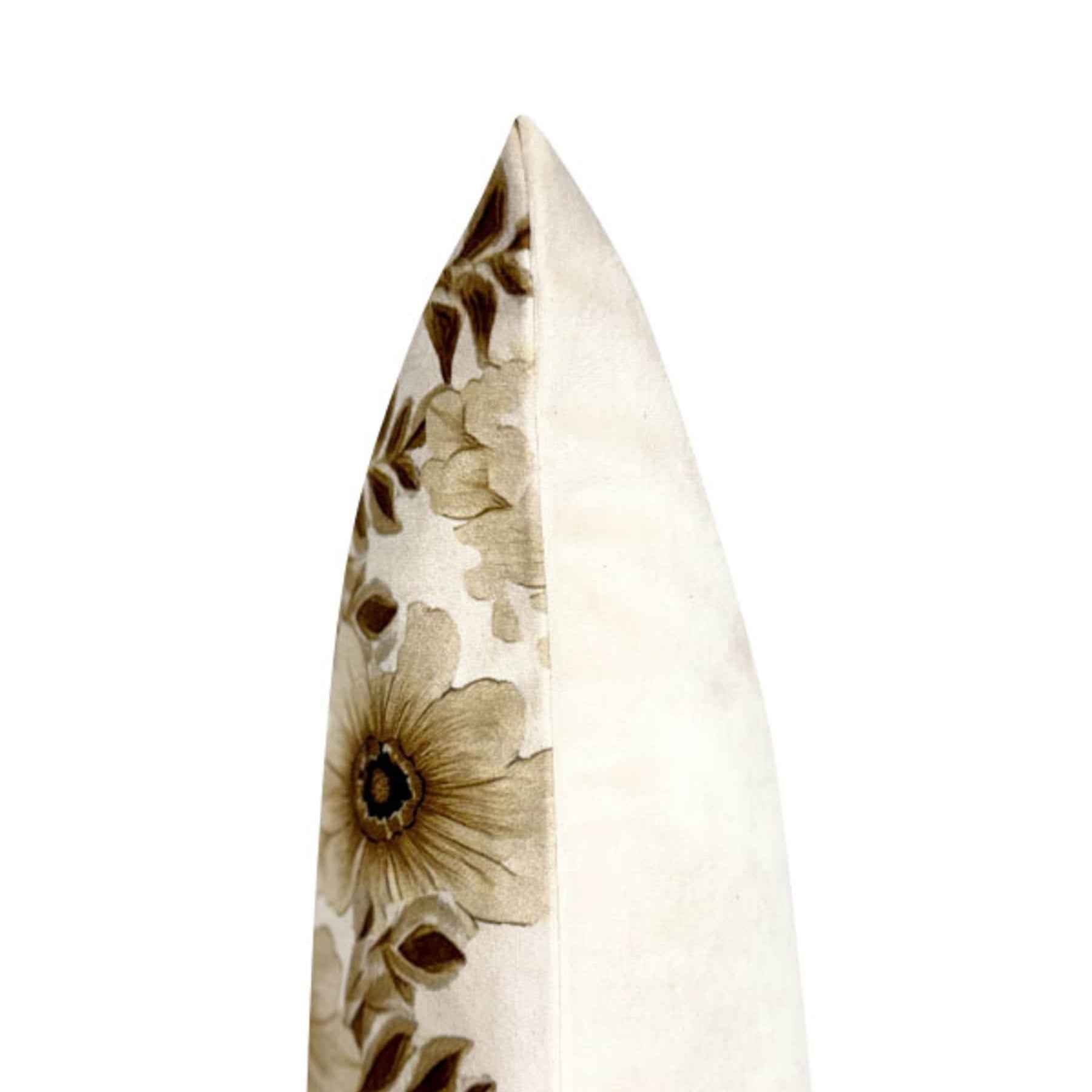 Close-up of the brown floral pattern and textured fabric on a 70s-inspired cushion.