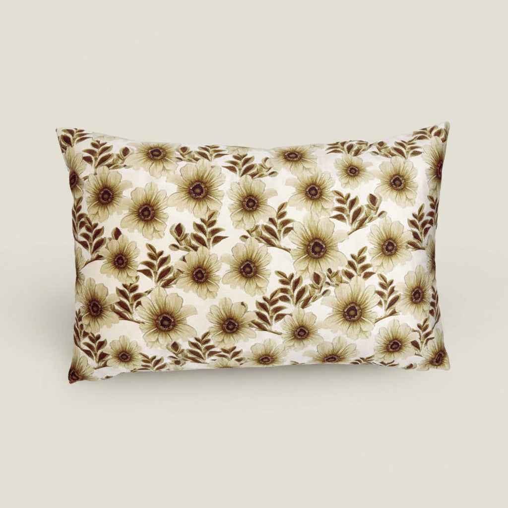 Seventies-inspired cushion featuring a vintage brown floral pattern in warm earthy tones.