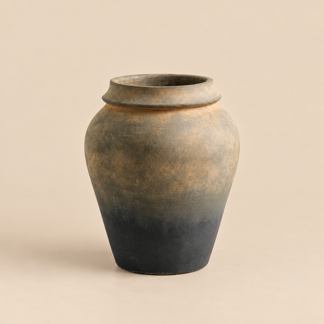 Aged black and bronze decorative vase with textured finish.