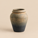 Aged black and bronze decorative vase with textured finish.