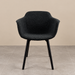 Discover our Black Bouclé Sculptural Dining Chair. Featuring luxurious textured upholstery, curved armrests and sleek black legs for a contemporary look.