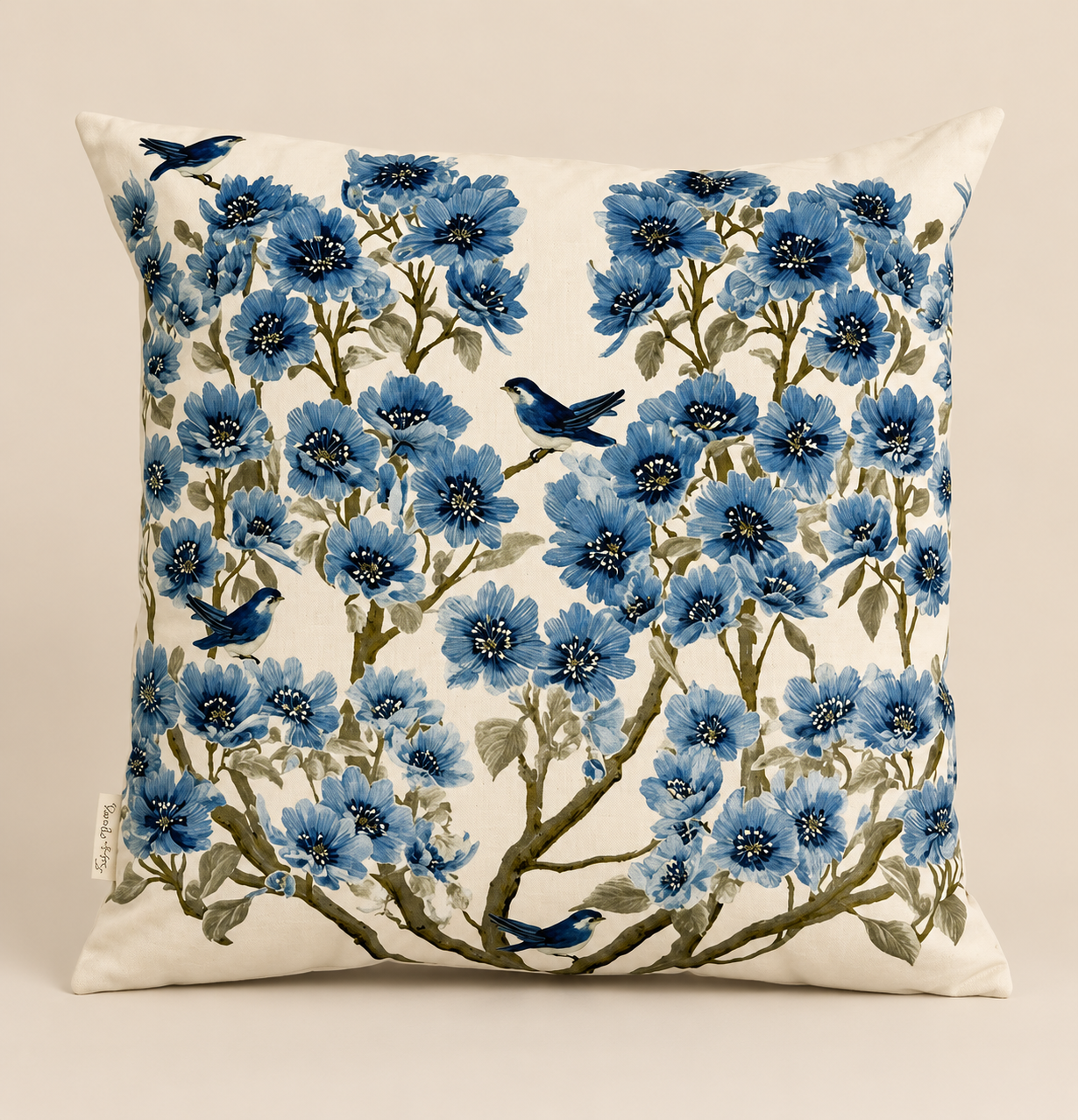 Blue Blossom & Bird decorative cushion featuring blue florals, delicate birds and green botanical detailing on a soft neutral background.