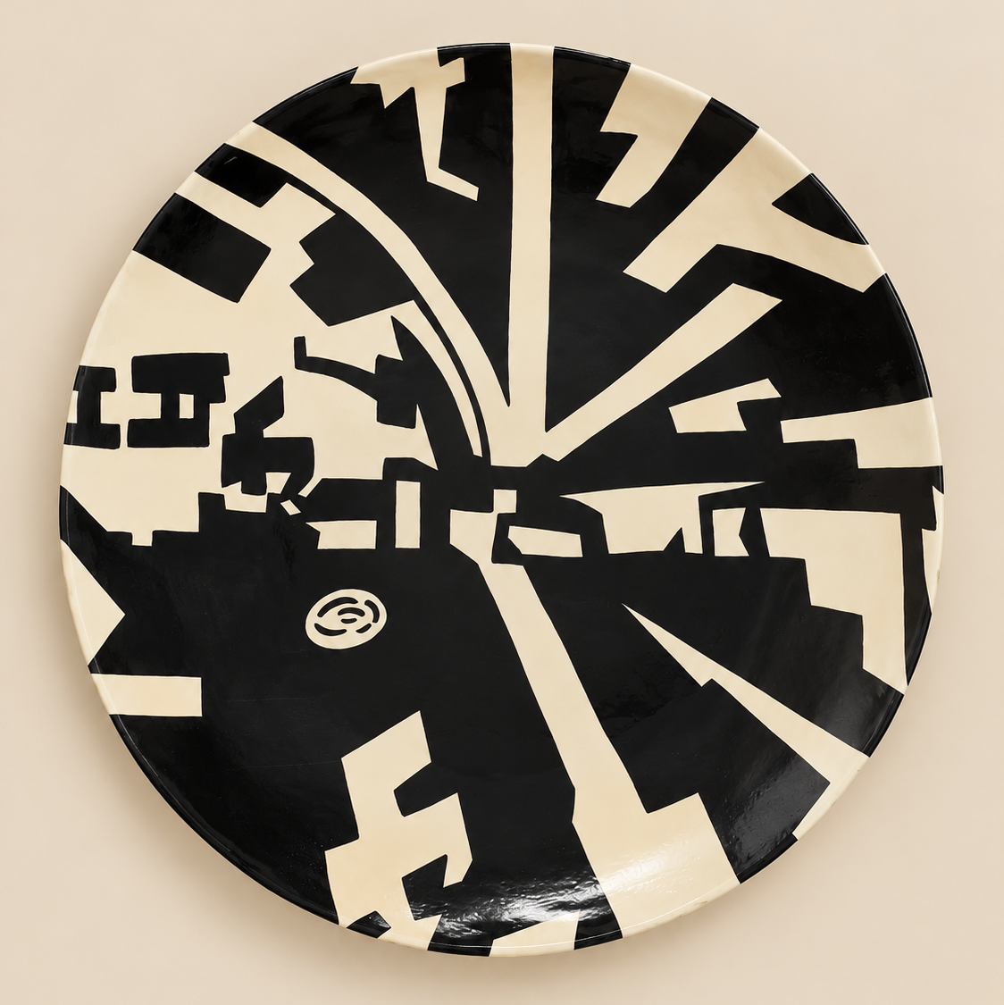Handmade black and cream abstract ceramic wall art plate.