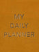 My Daily Planner styled on a desk with stationery in a modern workspace.