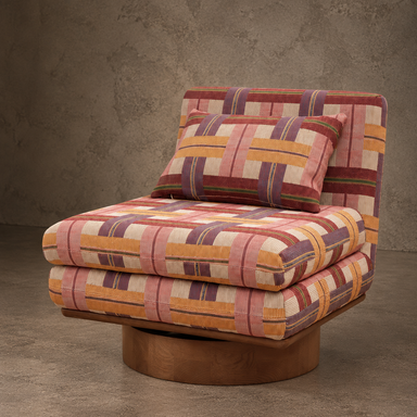 Arlo retro swivel lounge chair featuring pink, mustard, burgundy and lilac geometric upholstery, layered cushions and a circular wooden pedestal base.

