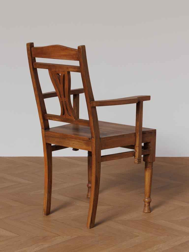 Close-up of the back angle curved wooden frame and craftsmanship of the Art Nouveau inspired accent chair.