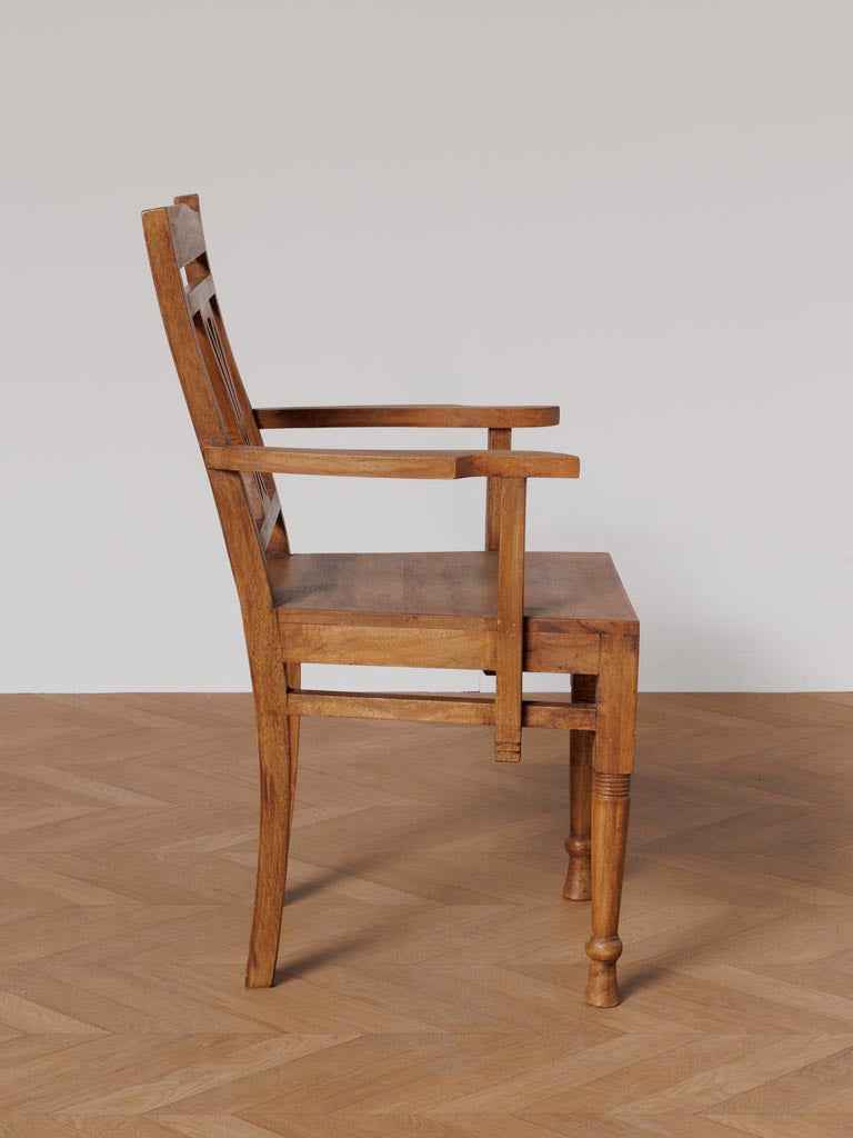 side view  of the curved wooden frame and craftsmanship of the Art Nouveau inspired accent chair.