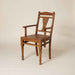 Art Nouveau inspired accent wooden chair with elegant curves, a sculptural silhouette and a timeless design.