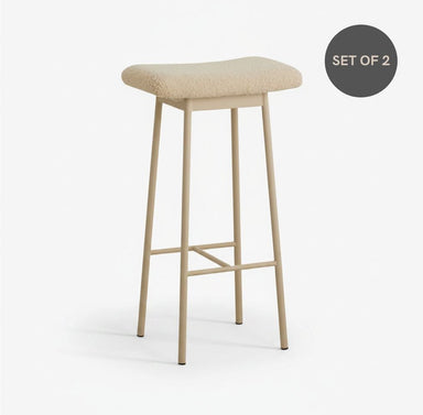 beige metal bar stool with soft teddy upholstery, a padded seat and a contemporary design.