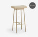 beige metal bar stool with soft teddy upholstery, a padded seat and a contemporary design.