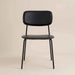 Black modern dining chair with a padded seat, curved backrest and slim metal legs.