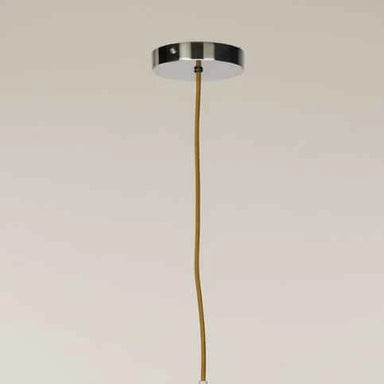 Close-up of the sculptural form and chrome finish of the contemporary ceiling light.