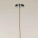 Close-up of the sculptural form and chrome finish of the contemporary ceiling light.