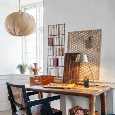 Handcrafted beige bamboo ceiling light styled in a contemporary dining room creating a warm, natural ambience.
