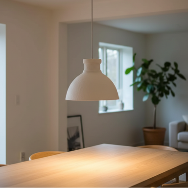 Handcrafted cotton maché lampshade with a textured finish and timeless natural design.