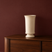 Discover our elegant ivory ceramic vase with a sculptural silhouette and vintage-inspired detailing. A timeless statement piece for beautifully curated interiors.