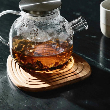 Close-up of the natural acacia wood grain and handcrafted finish of the large coaster.