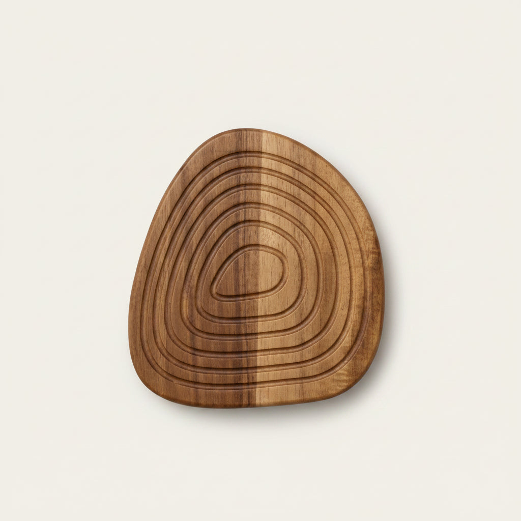Large acacia wood coaster with a natural grain, organic shape and timeless design.