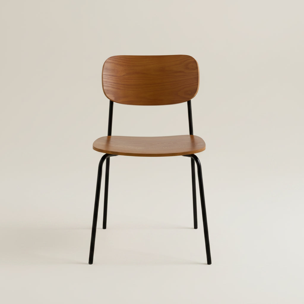 Mid-century walnut dining chair with black metal legs styled close of the wood grain