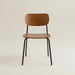 Mid-century walnut dining chair with black metal legs styled close of the wood grain