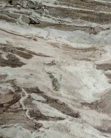 Close-up of the natural beige marble grain highlighting the unique character and finish of the dining table.