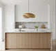 Nature bamboo hanging pendant light styled above kitchen island in a contemporary interior.