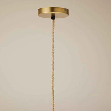 Close-up of the handcrafted woven cotton rope detailing and natural finish of the Nordic style ceiling lamp.
