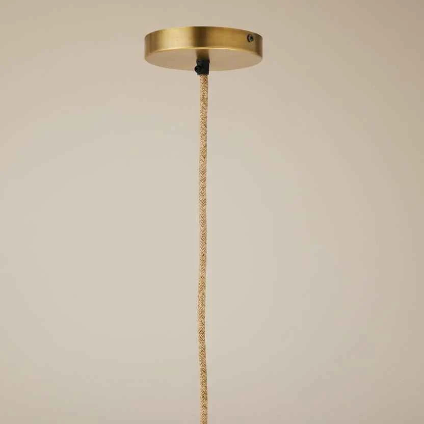 Close-up of the handcrafted woven cotton rope detailing and natural finish of the Nordic style ceiling lamp.