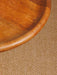 Close-up of the tabletop and craftsmanship of the round mid-century side table.