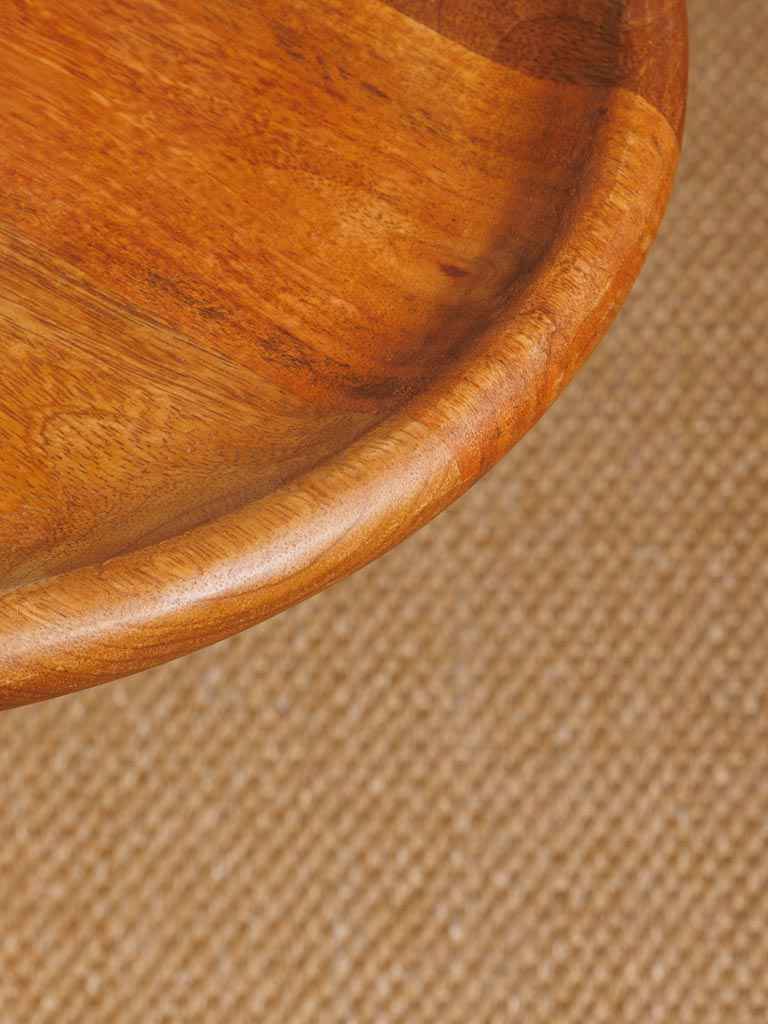 Close-up of the tabletop and craftsmanship of the round mid-century side table.