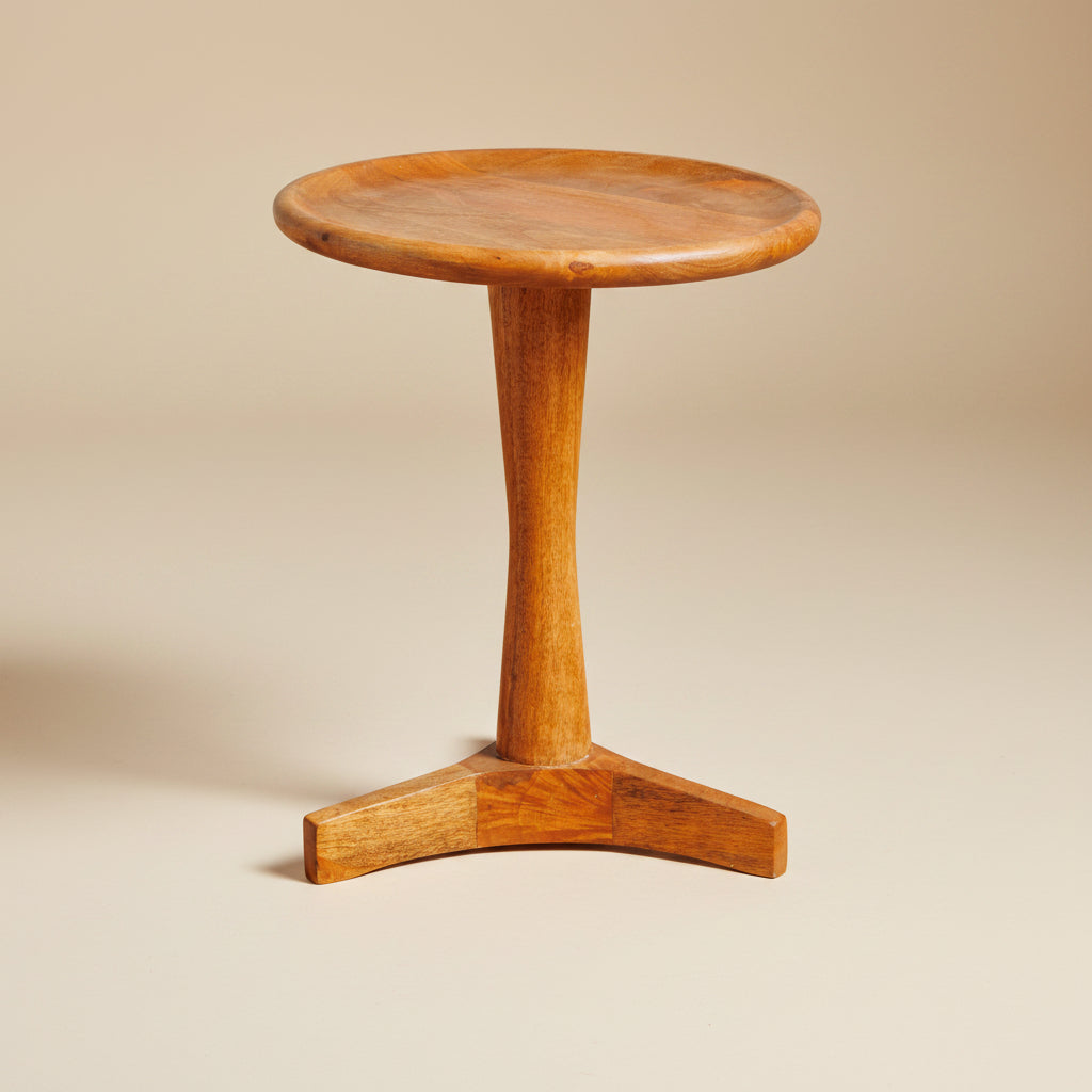 Round mid-century side table with a timeless design, clean lines and a natural wood finish.