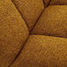 Close-up of the soft mustard boucle fabric highlighting the texture and craftsmanship of the sofa chair.