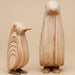 Set of 2 plywood penguin ornaments with a minimalist Scandinavian-inspired design crafted from natural wood.