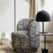 Textured matt black dome side lamp styled on a side table in a contemporary living room.