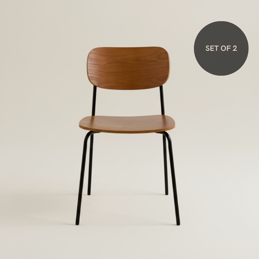 Walnut  plywoo dining chair with a curved wooden seat, matching backrest and black metal legs.