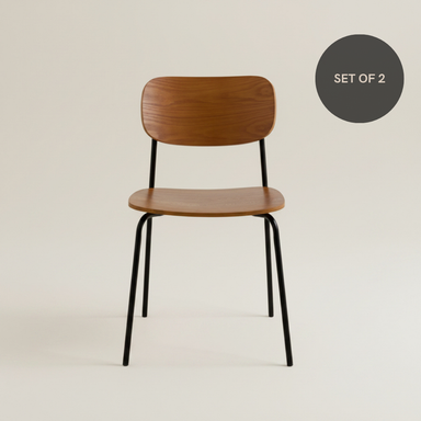Walnut  plywoo dining chair with a curved wooden seat, matching backrest and black metal legs.